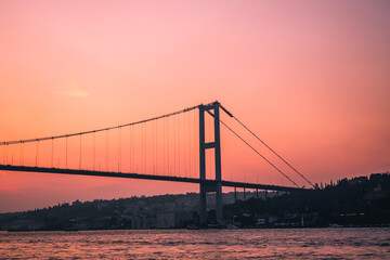 Obraz premium Sunset reflection on iconic bridge istanbul photography serene landscape wide angle architectural beauty