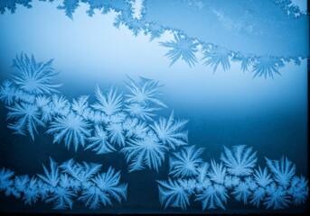 Obraz premium Frost patterns on window, intricate ethereal, creating a beautiful winter art, on a cold blue glass