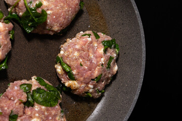 cooking raw turkey meatballs in a pan, healthy home meal
