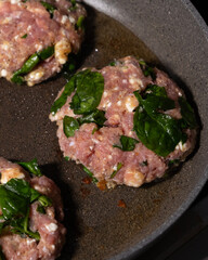 cooking raw turkey meatballs in a pan, healthy home meal