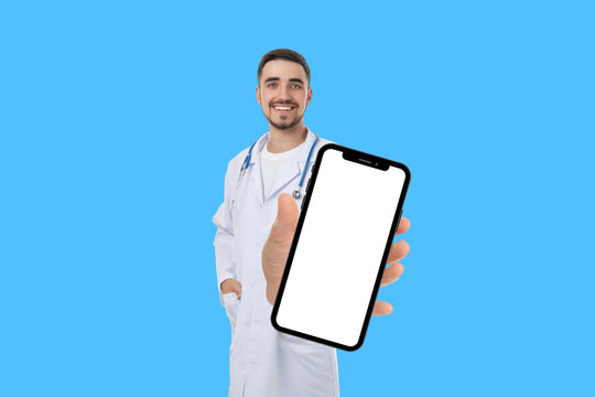 Doctor in lab coat displays smartphone during a consultation