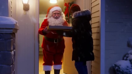 Santa Claus happily receiving a pizza delivery at his home. A perfect Christmas scene for food delivery company advertising.