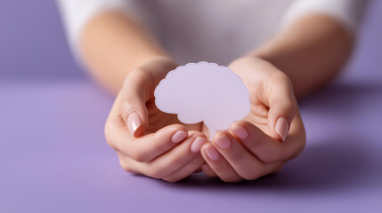 Hands hold brain cutout paper defocused head encephalography, faceless mental health, awareness visualization detail, blurred purple background, Alzheimer concept, autism interface
