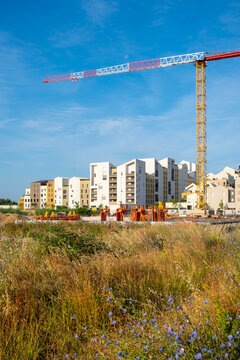 Architecture and construction driving urban development with cranes supporting new housing at the Montpellier France building site in a forward modern design setting