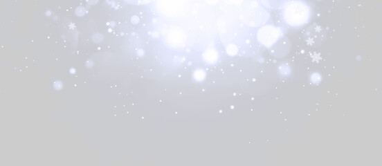 Fototapeta premium Monochrome abstract background with glowing bokeh lights and small white dots, creating depth, brightness, and an elegant festive atmosphere. Ideal for Christmas, New Year, or holiday designs.