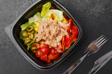Tuna salad with lettuce tomato corn red pepper and green olives for Mediterranean cuisine or healthy eating concept