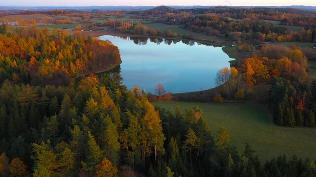 South Bohemian pond in autumn. Calm evening atmosphere in aerial footage. Czech Republic, Europe.	
