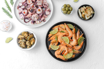 Seafood assortment with shrimp and octopus on white table for buffet, catering or menu concept