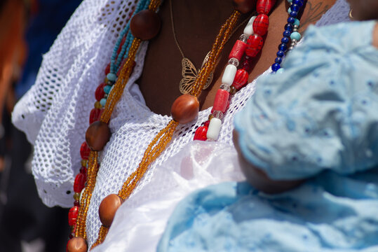 Details of the body and clothing of the Baianas do Acaraje participating in their day in Pelourinho, Salvador, Bahia.