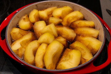 cooking apple pieces for Tatin apple pie, caramelized apples in butter and sugar, Mallorca, Balearic Islands, Spain