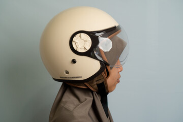 Cream Motorcycle Helmet With Clear Visor Side Profile Studio Shot