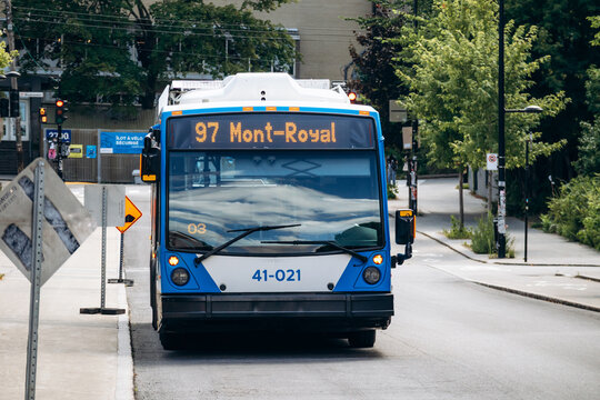 Montreal, Canada - August 14, 2025: City bus on route 97 Mont Royal driving along a street near the Biodome