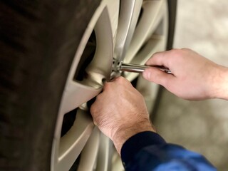 mechanic changing car wheel