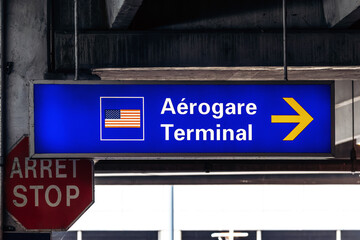 Montreal, Canada - August 15, 2025: Directional sign for the US terminal at Montreal Trudeau Airport
