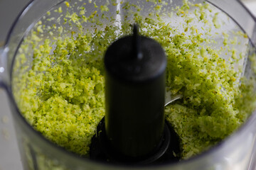 raw broccoli blended in a blender making broccoli rice, close up, healthy cooking