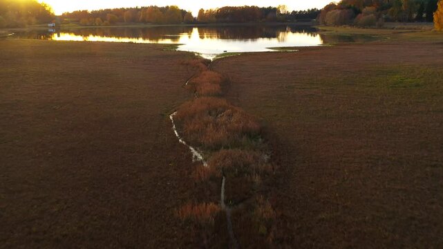 South Bohemian pond in autumn. Calm evening atmosphere in aerial footage. Czech Republic, Europe.	
