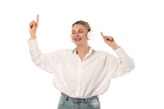 Woman dances joyfully while wearing headphones, isolated on white, PNG