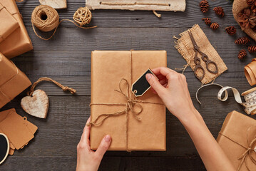 Woman wrapping Christmas gifts