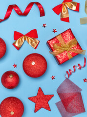 Red Christmas ornaments on blue background