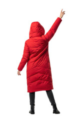 Faceless model in a vibrant red winter puffer coat with a hood stands in a dynamic pose on a white cyclorama. Concept for commercial fashion photography