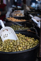 Green Olives in Bucket with Scoop