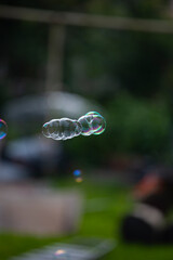 soap bubble is flying through the air 