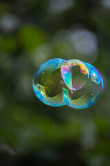 soap bubble is flying through the air 