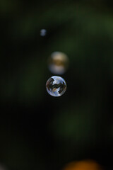 soap bubble is flying through the air 