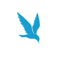 A stylized blue bird in midflight, with wings spread and head pointing downwards, creating a sense of graceful descent or focused movement, isolated on