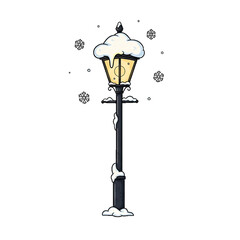 A tall vintage streetlamp covered in snowflakes on a cold winter night.