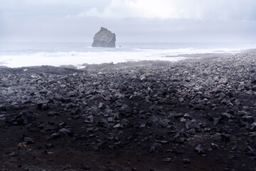 particular rock in the stretch of coast called Valahnukamol in the Reykjanes Peninsula during a cloudy day