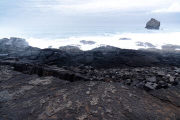 rock formations on the stretch of coast called Valahnukamol on the Reykjanes Peninsula during a cloudy day