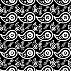 Seamless black-and-white paisley pattern of teardrop motifs with concentric circles and dots, forming a bold ornamental textile design