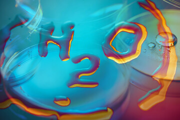 Close-up texture of water drops on glass withformula H2O.