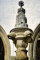 16th-century water fountain (Chafariz da Vila) with four fish heads in front of the National Palace (Palácio Nacional) in Sintra, Portugal
