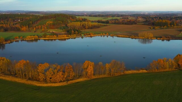 South Bohemian pond in autumn. Calm evening atmosphere in aerial footage. Czech Republic, Europe.	

