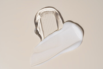 Soothe cream lotion moisturizer gel smears on beige background. Skincare and body beauty product. Liquid gel cosmetic smudges