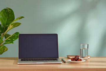 Minimalist workspace with laptop and plant