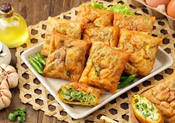 Martabak Telur. Mini egg martabak is a snack made from eggs. Its delicious taste and mini shape make it suitable for serving as a family snack.