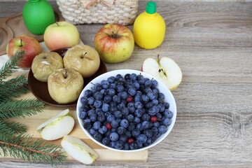 Winter sloes and oven-baked apples on the table on winter days