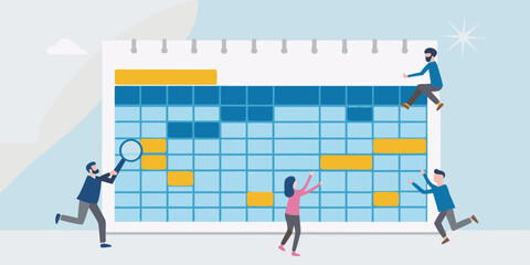 Team collaborating on a large calendar or schedule