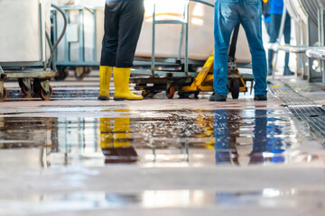 Close up view of a wet floor in an industrial laundry.