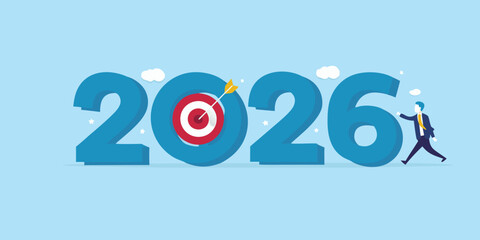 Businessman reaching 2026 goals with target and arrow