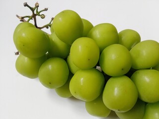 green grapes. close-up of fresh green grapes on white background.