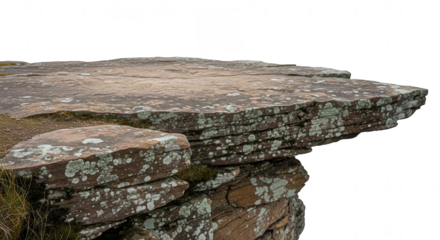 Weathered natural rock platform with rugged texture and lichen on transparent background.