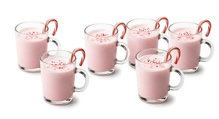 Pink drinks in glasses with candy canes on a white background