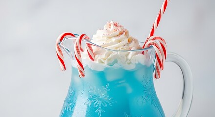 Blue beverage in clear pitcher with whipped cream and candy canes