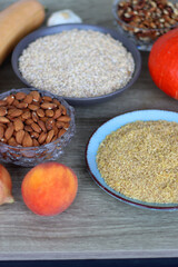 Assortment of various healthy fruits, vegetables, grains and legumes. Selective focus, wooden background.