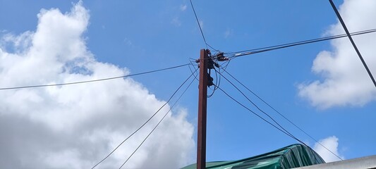 Fototapeta premium Electric poles and blue sky