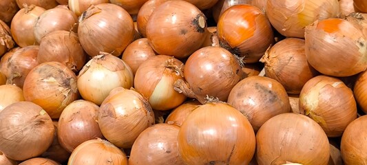 Onions in the market for background. Natural food concept.